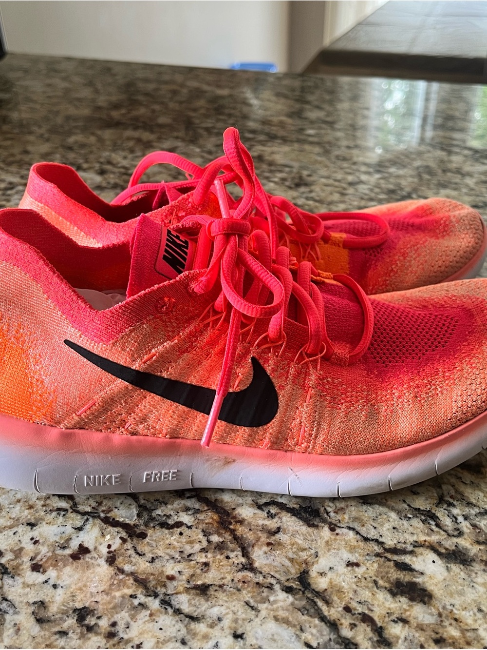 Nike Women's Flyknit Running Sneakers in Neon Pink and Orange
